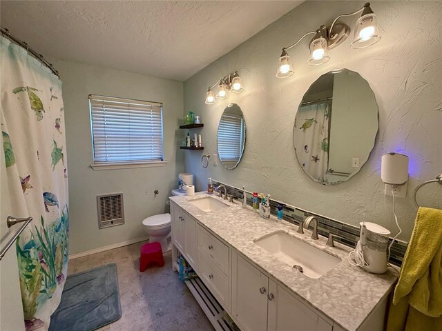 1000 Winnipeg Dr, Yukon, OK 73099 - bathroom with a textured ceiling, double vanity, heating unit, toilet, and baseboards
