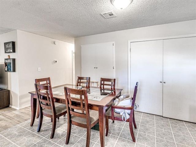 1810 Haynie Ln, Prague, OK 74864 - dining room featuring a textured ceiling