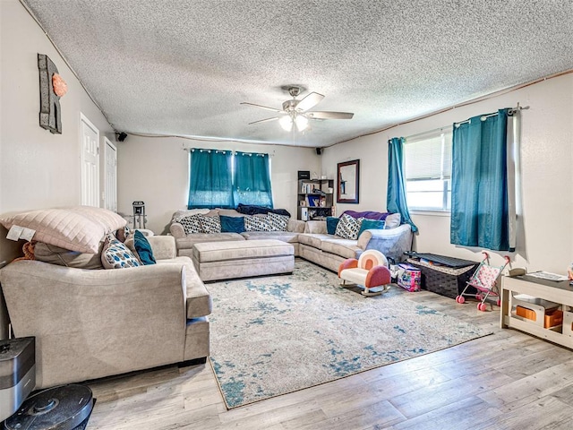 1810 Haynie Ln, Prague, OK 74864 - living room with ceiling fan, wood finished floors, and a textured ceiling