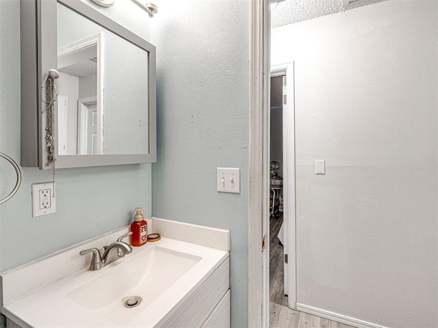 1810 Haynie Ln, Prague, OK 74864 - bathroom with vanity and wood finished floors