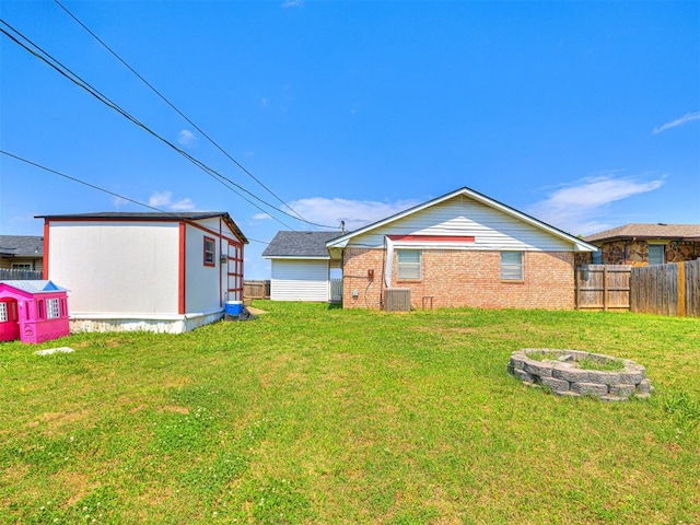 1810 Haynie Ln, Prague, OK 74864 - rear view of property with central AC and brick siding