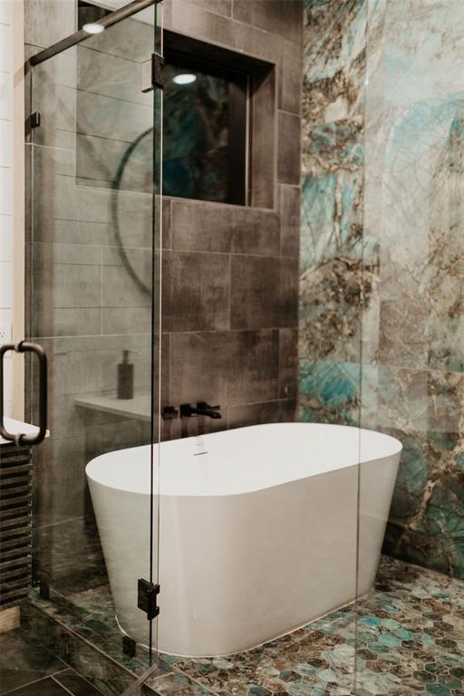 2 Timber Passage Trl, Broken Bow, OK 74728 - bathroom featuring tile walls, a shower stall, and a soaking tub