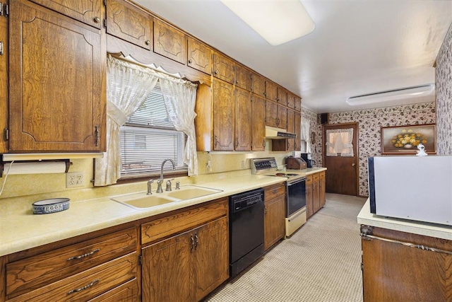 111 W Colorado Ave, Okarche, OK 73762 - kitchen featuring dishwasher, electric range oven, under cabinet range hood, a sink, and wallpapered walls