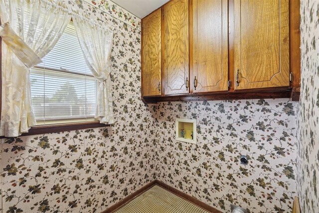 111 W Colorado Ave, Okarche, OK 73762 - laundry area with wallpapered walls, cabinet space, baseboards, and washer hookup