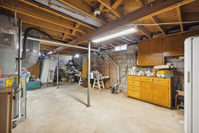 111 W Colorado Ave, Okarche, OK 73762 - unfinished below grade area with white fridge with ice dispenser