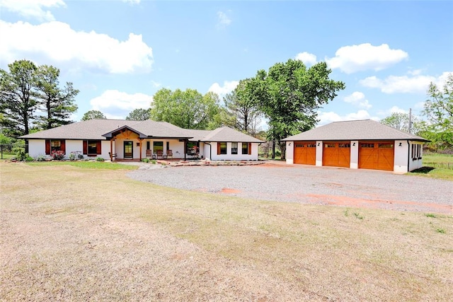 11790 E Etowah Rd, Noble, OK 73068 - view of front of property with a detached garage, a porch, an outdoor structure, driveway, and a front lawn