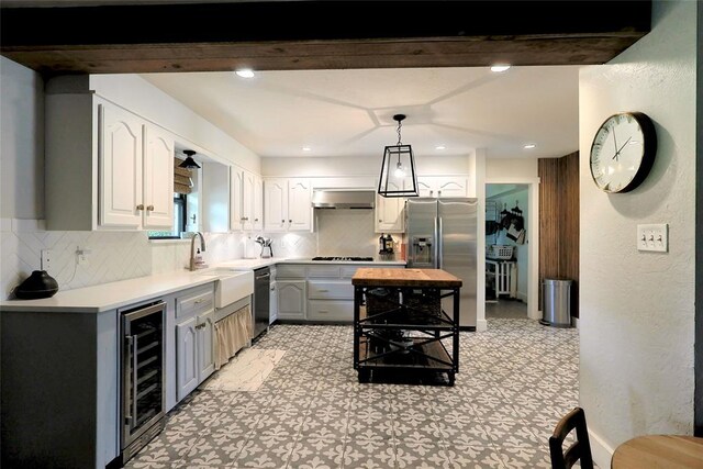 11790 E Etowah Rd, Noble, OK 73068 - kitchen featuring beverage cooler, black appliances, a sink, decorative backsplash, and recessed lighting