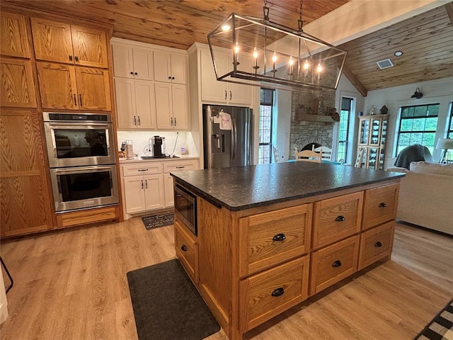 11790 E Etowah Rd, Noble, OK 73068 - kitchen with appliances with stainless steel finishes, wood ceiling, open floor plan, lofted ceiling, and a chandelier