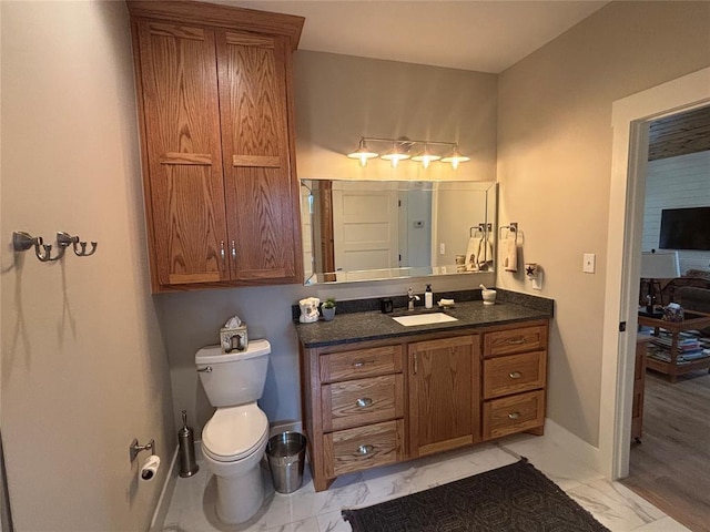11790 E Etowah Rd, Noble, OK 73068 - bathroom with marble finish flooring, vanity, toilet, and baseboards