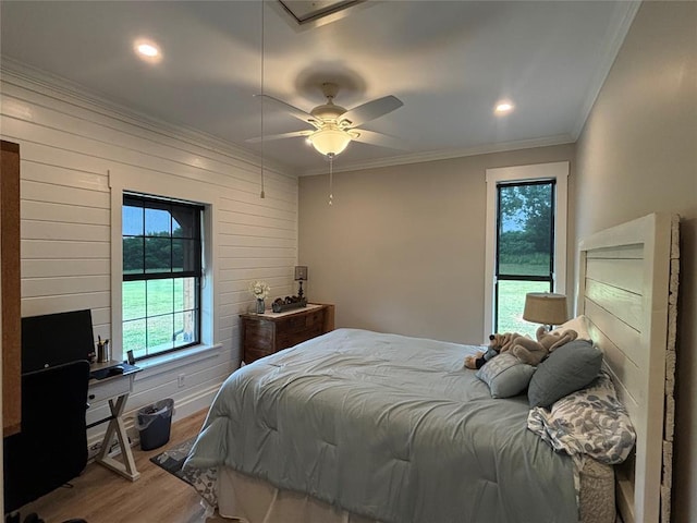 11790 E Etowah Rd, Noble, OK 73068 - bedroom with wood finished floors, ornamental molding, wooden walls, ceiling fan, and recessed lighting