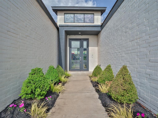 15929 Aparados Way, Edmond, OK 73013 - view of exterior entry with stucco siding and french doors
