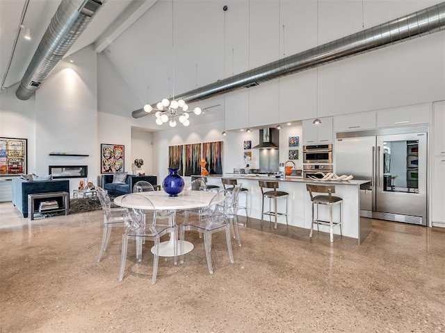 15929 Aparados Way, Edmond, OK 73013 - dining space featuring high vaulted ceiling, a chandelier, beam ceiling, and speckled floor
