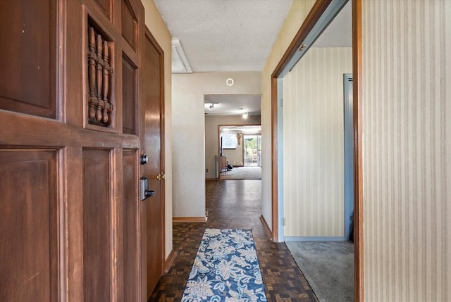 5712 NW 34th St, Oklahoma City, OK 73122 - corridor featuring baseboards and a textured ceiling