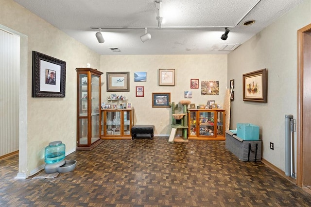 5712 NW 34th St, Oklahoma City, OK 73122 - living area with rail lighting and baseboards