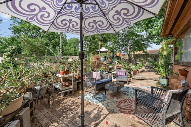 5712 NW 34th St, Oklahoma City, OK 73122 - fenced backyard with a wooden deck and outdoor lounge area