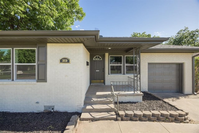 2020 Hasley Dr, The Village, OK 73120 - view of front facade with brick siding, crawl space, an attached garage, and concrete driveway