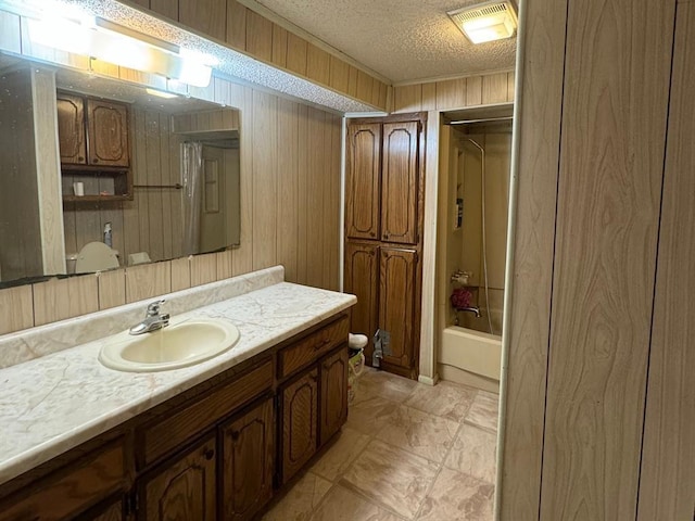 201 N Sheridan Ave, Dover, OK 73734 - full bath featuring vanity, a textured ceiling, tub / shower combination, and wooden walls