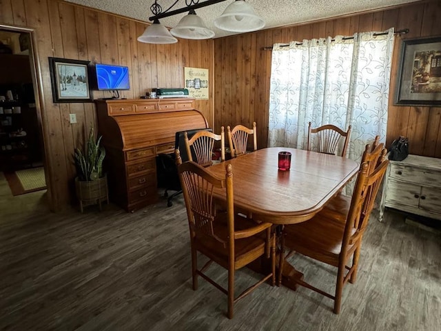201 N Sheridan Ave, Dover, OK 73734 - dining room featuring a textured ceiling, wooden walls, and dark wood finished floors