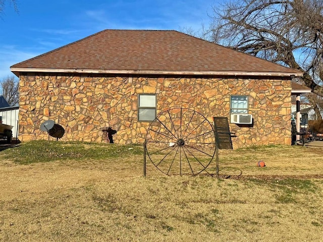 201 N Sheridan Ave, Dover, OK 73734 - view of home's exterior featuring stone siding, a shingled roof, cooling unit, and a lawn