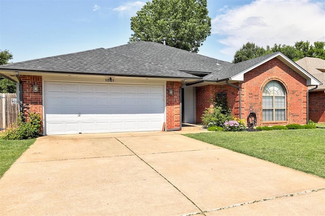1001 Glacier Ln, Edmond, OK 73003 - ranch-style home featuring brick siding, a shingled roof, a garage, and concrete driveway