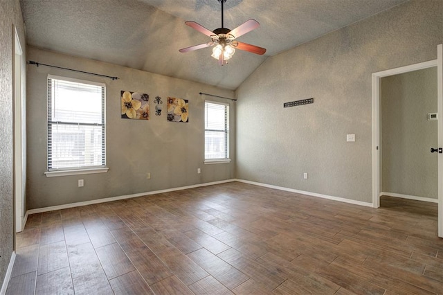 1001 Glacier Ln, Edmond, OK 73003 - empty room featuring lofted ceiling, a ceiling fan, wood finished floors, and a textured ceiling