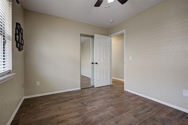 1001 Glacier Ln, Edmond, OK 73003 - unfurnished bedroom with wood finished floors, baseboards, and ceiling fan