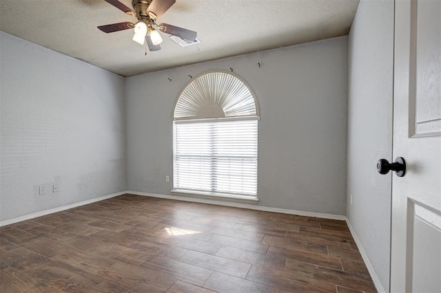 1001 Glacier Ln, Edmond, OK 73003 - empty room with a ceiling fan, wood finished floors, and baseboards