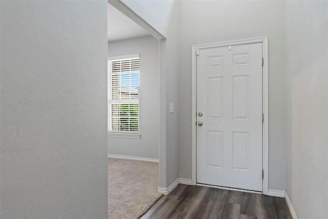 11325 SW 34th Ter, Yukon, OK 73099 - foyer entrance featuring baseboards, dark wood-type flooring, and a textured wall