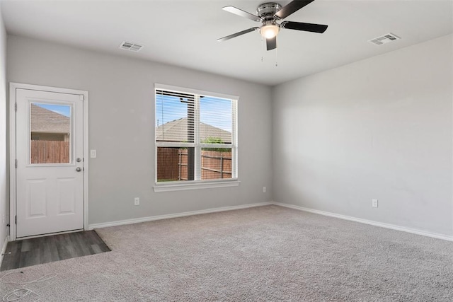 11325 SW 34th Ter, Yukon, OK 73099 - empty room featuring carpet floors, baseboards, and a ceiling fan