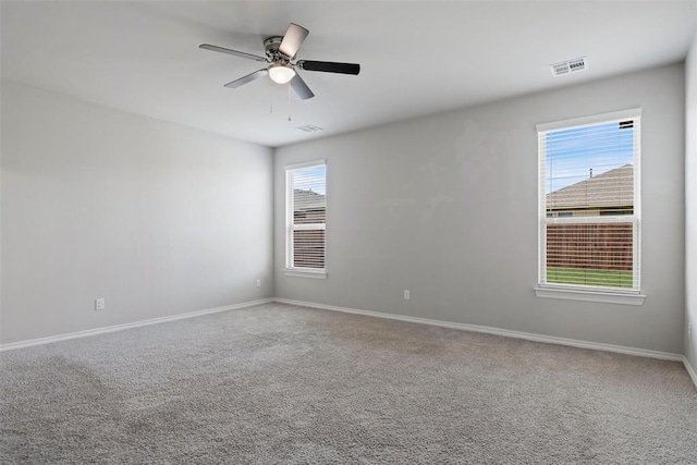 11325 SW 34th Ter, Yukon, OK 73099 - carpeted empty room featuring baseboards and a ceiling fan
