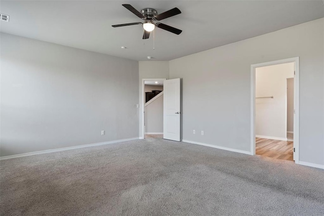 11325 SW 34th Ter, Yukon, OK 73099 - unfurnished bedroom with carpet floors, baseboards, and ceiling fan
