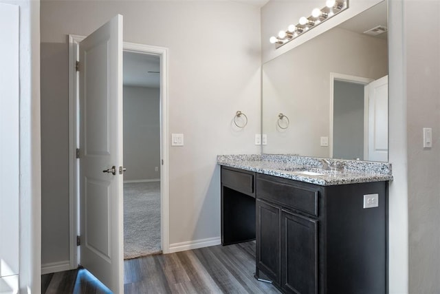 11325 SW 34th Ter, Yukon, OK 73099 - bathroom with wood finished floors, vanity, and baseboards