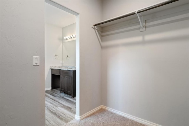11325 SW 34th Ter, Yukon, OK 73099 - spacious closet with light wood finished floors
