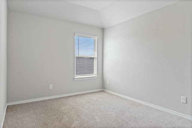 11325 SW 34th Ter, Yukon, OK 73099 - spare room featuring carpet flooring, baseboards, and lofted ceiling