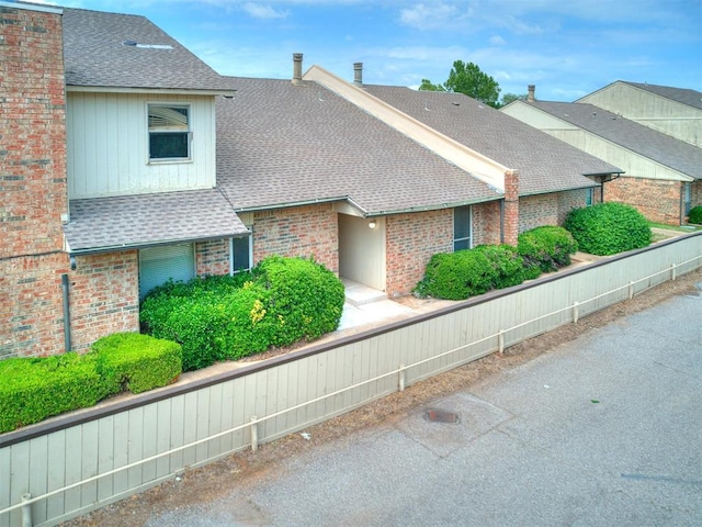 10125 N Pennsylvania Ave Unit 4, Oklahoma City, OK 73120 - view of front of property featuring brick siding and a shingled roof