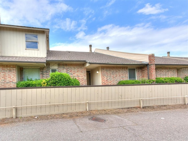 10125 N Pennsylvania Ave Unit 4, Oklahoma City, OK 73120 - view of front of property with brick siding and roof with shingles