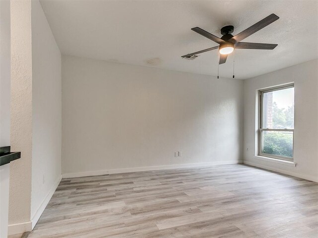 10125 N Pennsylvania Ave Unit 4, Oklahoma City, OK 73120 - unfurnished room with light wood finished floors, ceiling fan, and baseboards