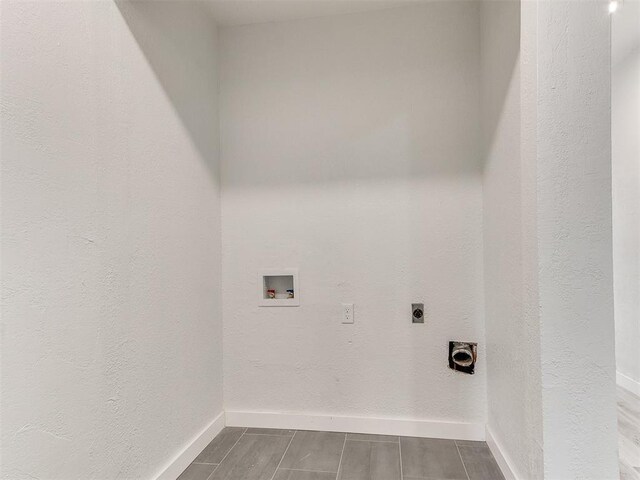 10125 N Pennsylvania Ave Unit 4, Oklahoma City, OK 73120 - laundry room with electric dryer hookup, baseboards, wood finish floors, and washer hookup