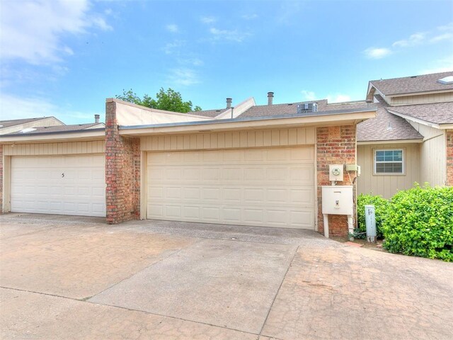 10125 N Pennsylvania Ave Unit 4, Oklahoma City, OK 73120 - view of front of property with driveway, roof with shingles, and an attached garage