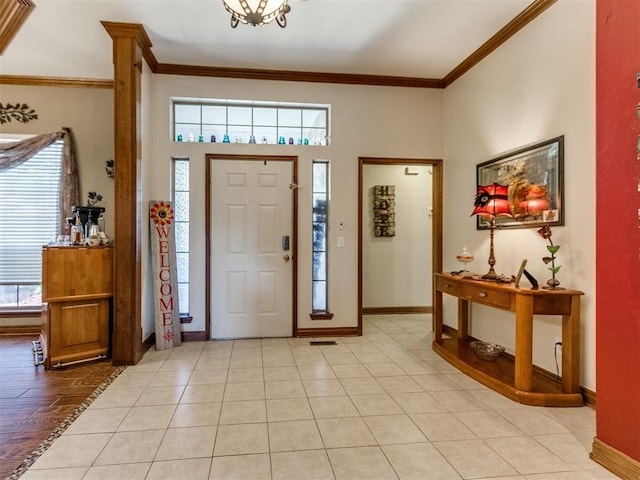 19609 Filly Dr, Edmond, OK 73003 - foyer featuring healthy amount of natural light, ornamental molding, and baseboards