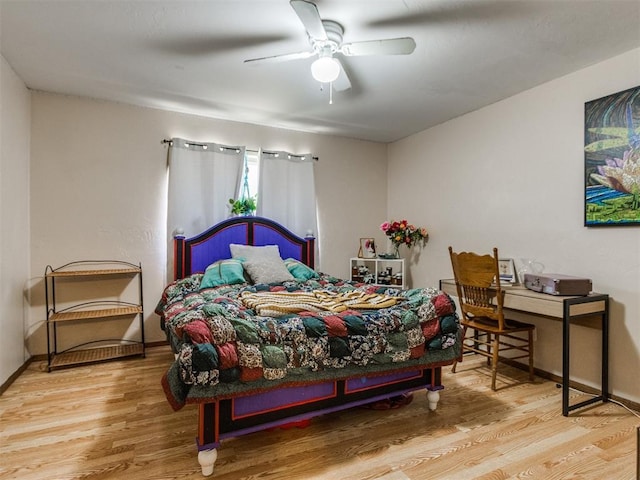 19609 Filly Dr, Edmond, OK 73003 - bedroom featuring wood finished floors, baseboards, and ceiling fan