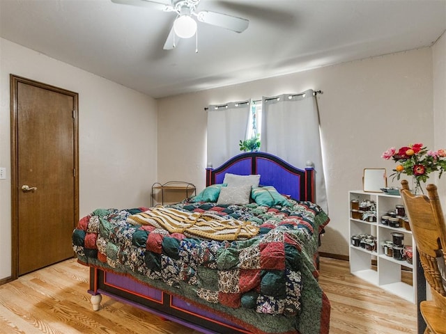 19609 Filly Dr, Edmond, OK 73003 - bedroom with wood finished floors and a ceiling fan