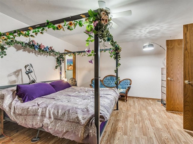 19609 Filly Dr, Edmond, OK 73003 - bedroom with wood finished floors, baseboards, and ceiling fan