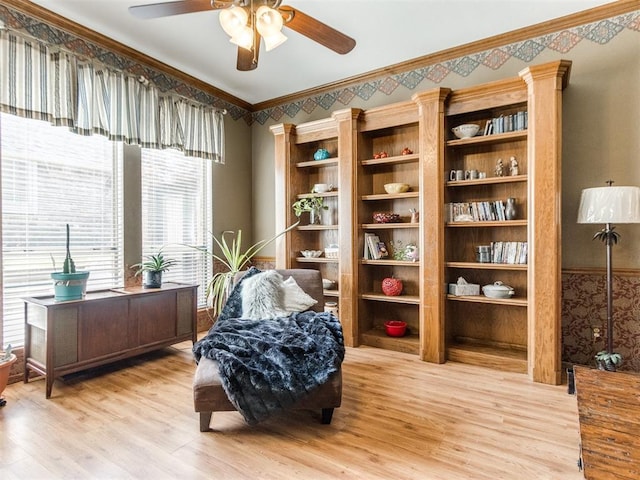 19609 Filly Dr, Edmond, OK 73003 - living area with a ceiling fan, light wood-style flooring, and ornamental molding