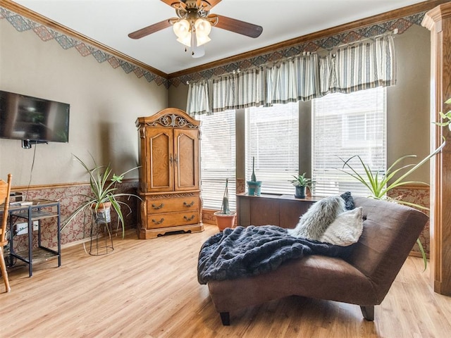 19609 Filly Dr, Edmond, OK 73003 - sitting room with light wood finished floors, a ceiling fan, baseboards, and ornamental molding
