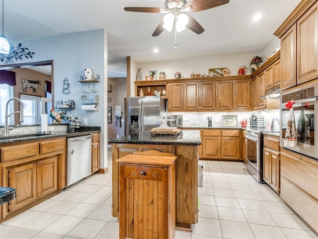 19609 Filly Dr, Edmond, OK 73003 - kitchen featuring stainless steel appliances, a sink, open shelves, a kitchen island, and light tile patterned flooring