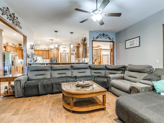19609 Filly Dr, Edmond, OK 73003 - living room with ceiling fan and light wood-type flooring