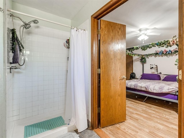 19609 Filly Dr, Edmond, OK 73003 - full bathroom featuring a shower stall, ensuite bath, wood finished floors, and a ceiling fan