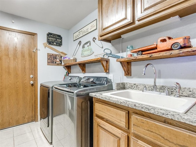 19609 Filly Dr, Edmond, OK 73003 - laundry area featuring independent washer and dryer, cabinet space, and light tile patterned floors