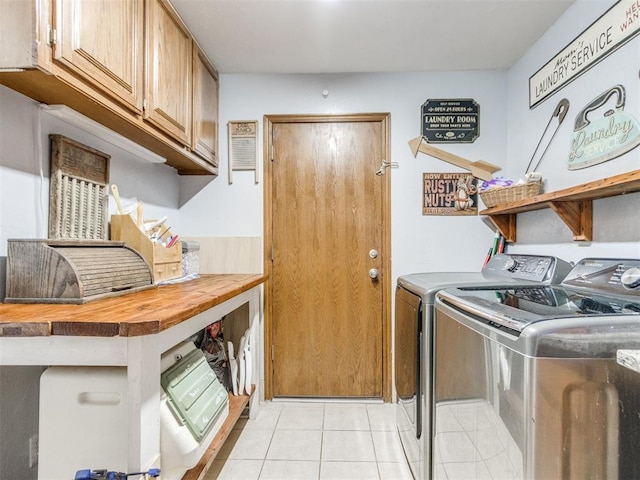 19609 Filly Dr, Edmond, OK 73003 - washroom with cabinet space, washing machine and clothes dryer, and light tile patterned flooring